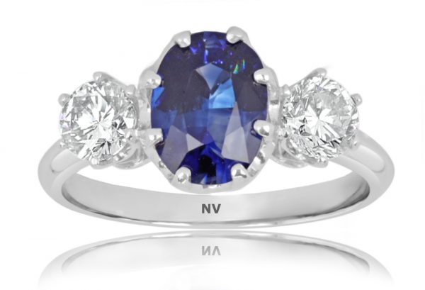 18ct white gold ladies ring set with 1x2.13ct Oval shape Ceylon Sapphire and 2=.71ct round brilliant cut diamonds.
