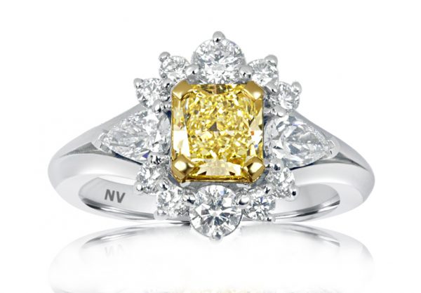 18ct white gold ladies engagement ring set with 1x1.00 Fancy Intense Yellow Diamond, Clarity VS1 GIA Certified and 2=.40ct pear shape, 10=.43ct round brilliant cut diamonds.